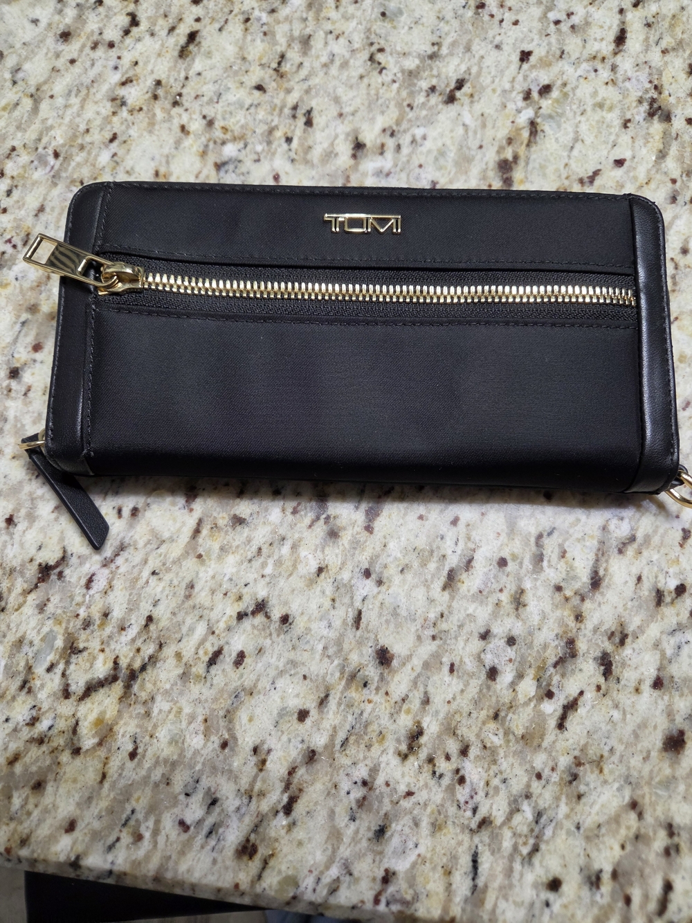 Tumi Black Zip-Around Wallet with Gold Hardware